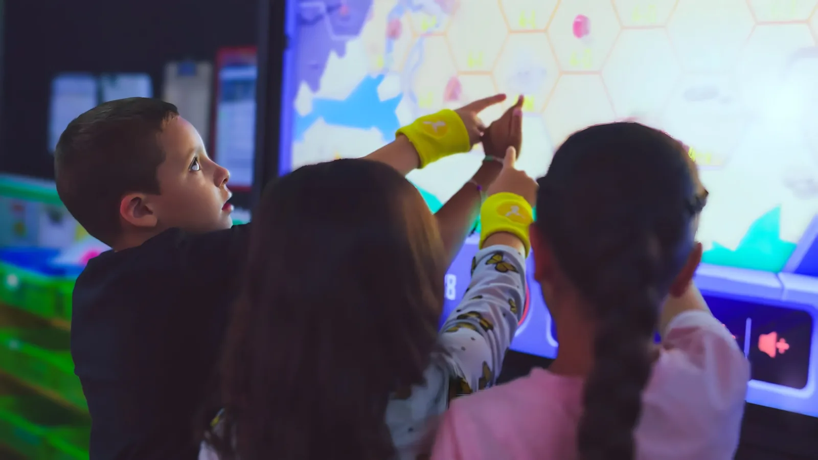 Students working at an interactive classroom screen